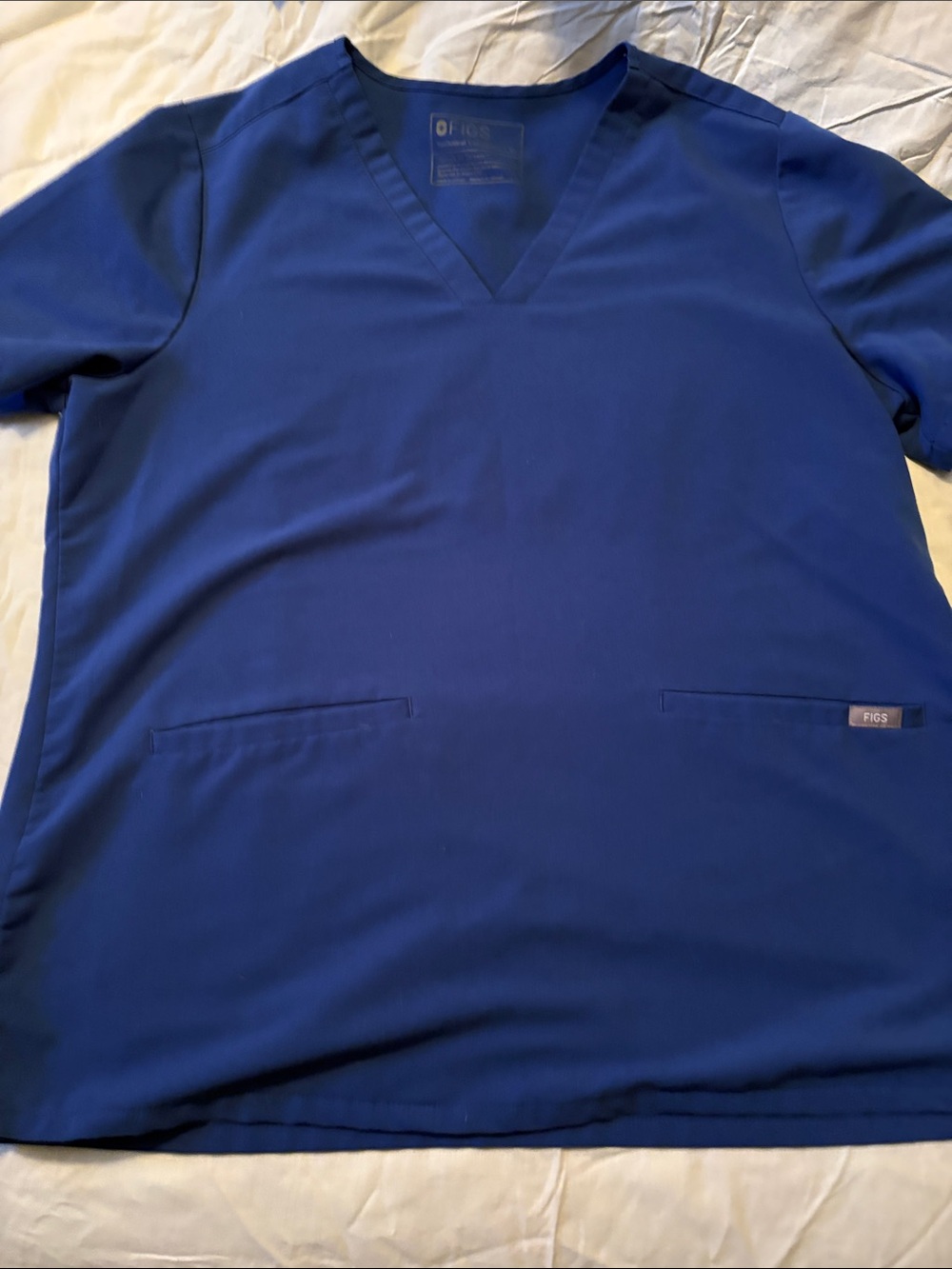 Figs womens scrub tops. Winning Blue 4 available. 10$ each or 30$ for all four